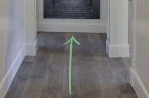 A professional decorator tells her clients to put <em>this </em>at the end of a narrow hallway
