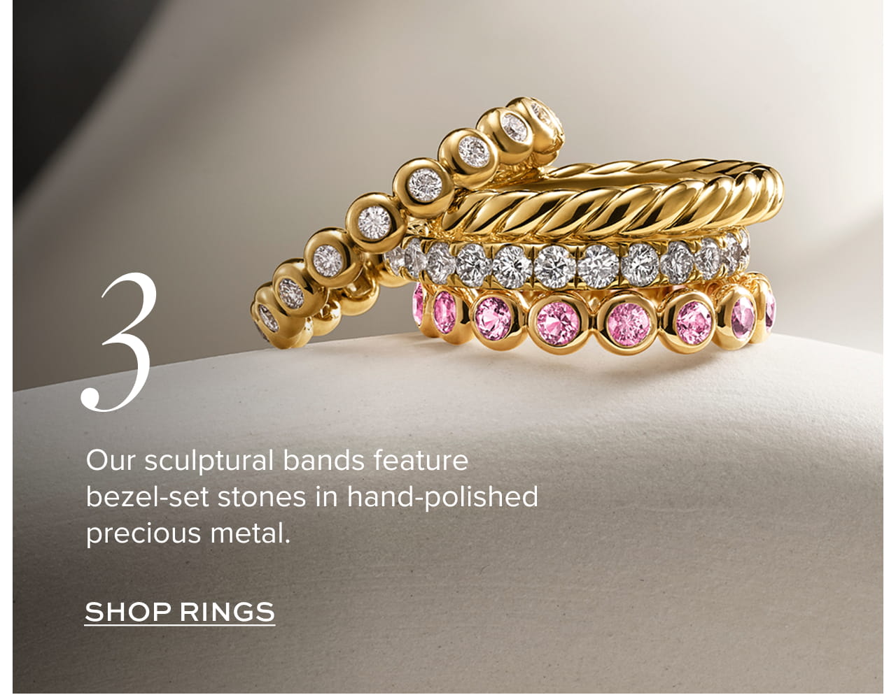 Our sculptural bands feature bezel-set stones in hand-polished precious metal.