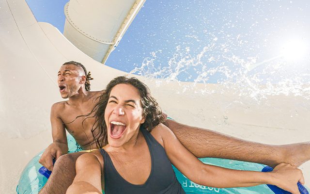Two friends on a water ride at Adventure Island