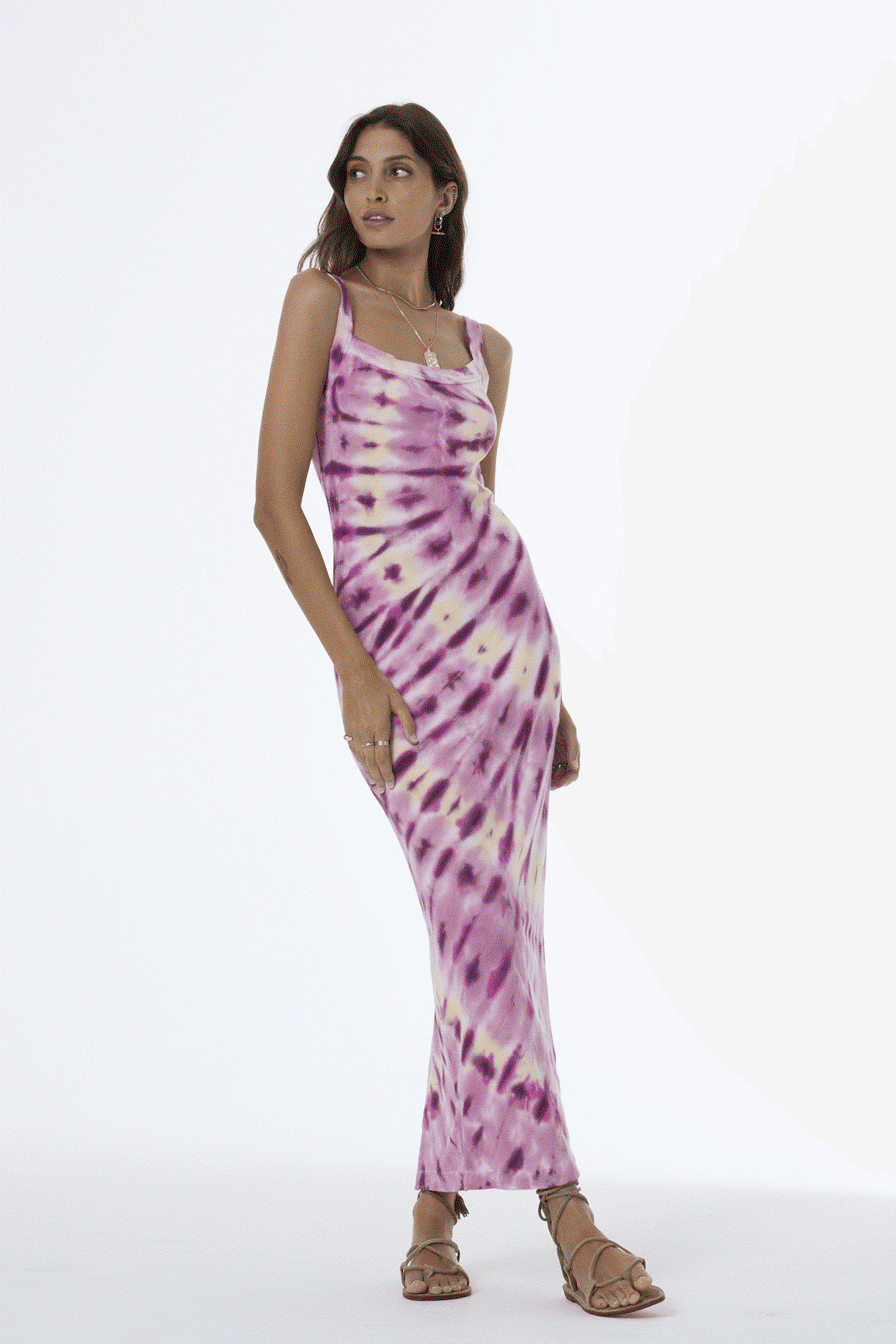 Woman wearing a Pink tie-dye dress with a white background
