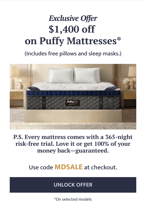 an image of a bed with a mattress and pillows on it
