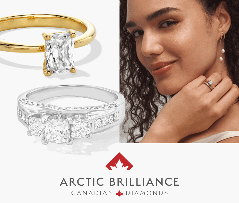 Woman wearing pearl drop earrings and diamond rings, alongside diamond rings. Arctic Brilliance logo.