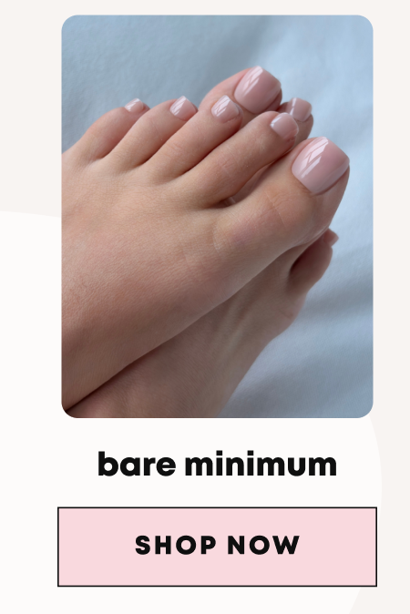 Feet with glossy pink nude toenails against light blue background, labeled bare minimum