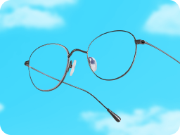 Slim metal glasses against a blue sky