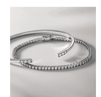 Silver diamond tennis bracelet and open cuff bracelet set.