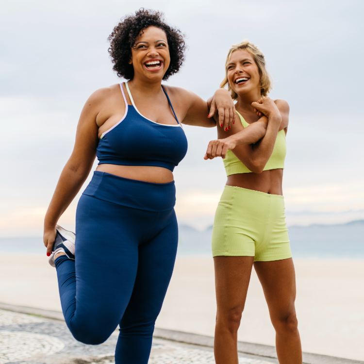 Two women stretching 