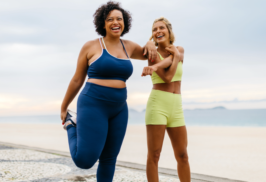 Two women stretching 