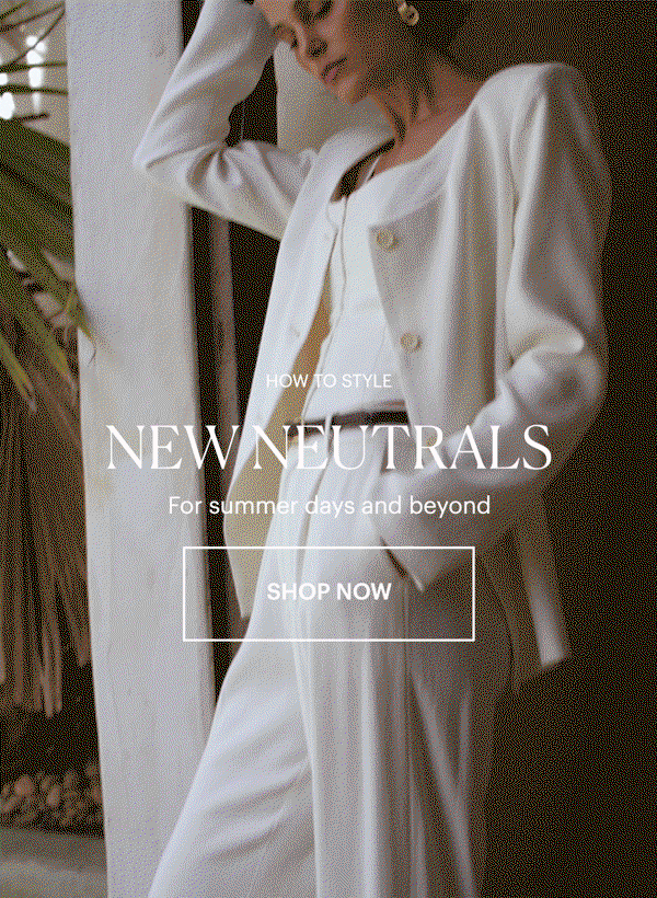 How To Style: New Neutrals - For summer days and beyond. Shop now. GIF of a woman wearing a cotton linen white blazer and matching trousers with a thin brown leather gold-buckle belt and a structured white tank, surrounded by beige stone walls and greenery.