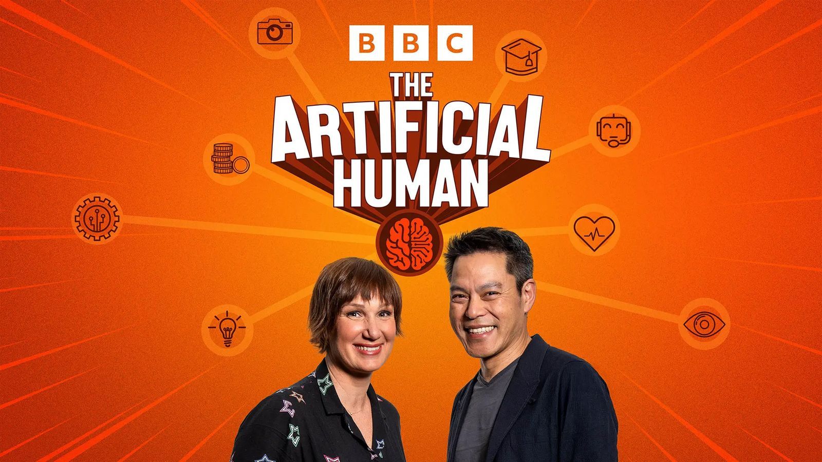 Aleks Krotoski and Kevin Fong smile at the camera, and are pictured from the shoulders up at the bottom of a graphic which has a bright orange background. There are small circular line-drawn images of cogs, a pile of coins, a manual camera, a robot, and light bulb. White text in the centre reads ‘The Artificial Human’ and there is a small circular graphic of a brain from in orange. The BBC logo is in white at the top.