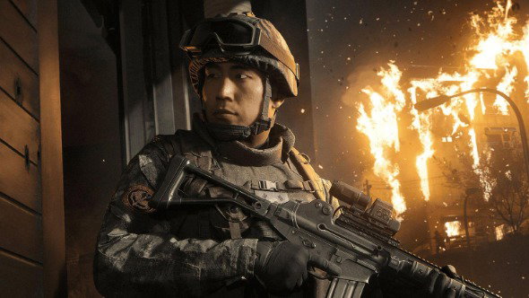 An in-game screenshot shows an artificially-generated male Korean soldier, wearing a helmet and combat gear, holding a gun with a building on fire behind him.
