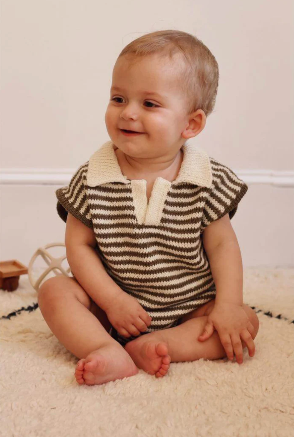 baby wearing a knit romper