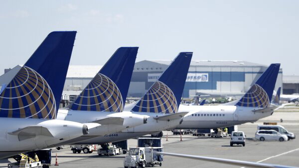 United Airlines commercial jets sit at a gate at Terminal C of Newark Liberty International Airport in Newark, N.J. 