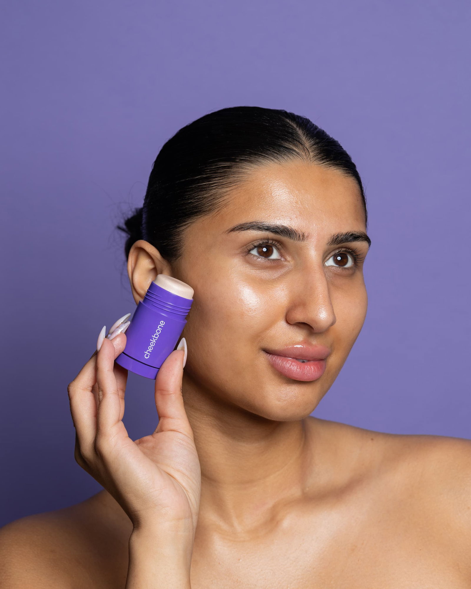 woman holding primer stick