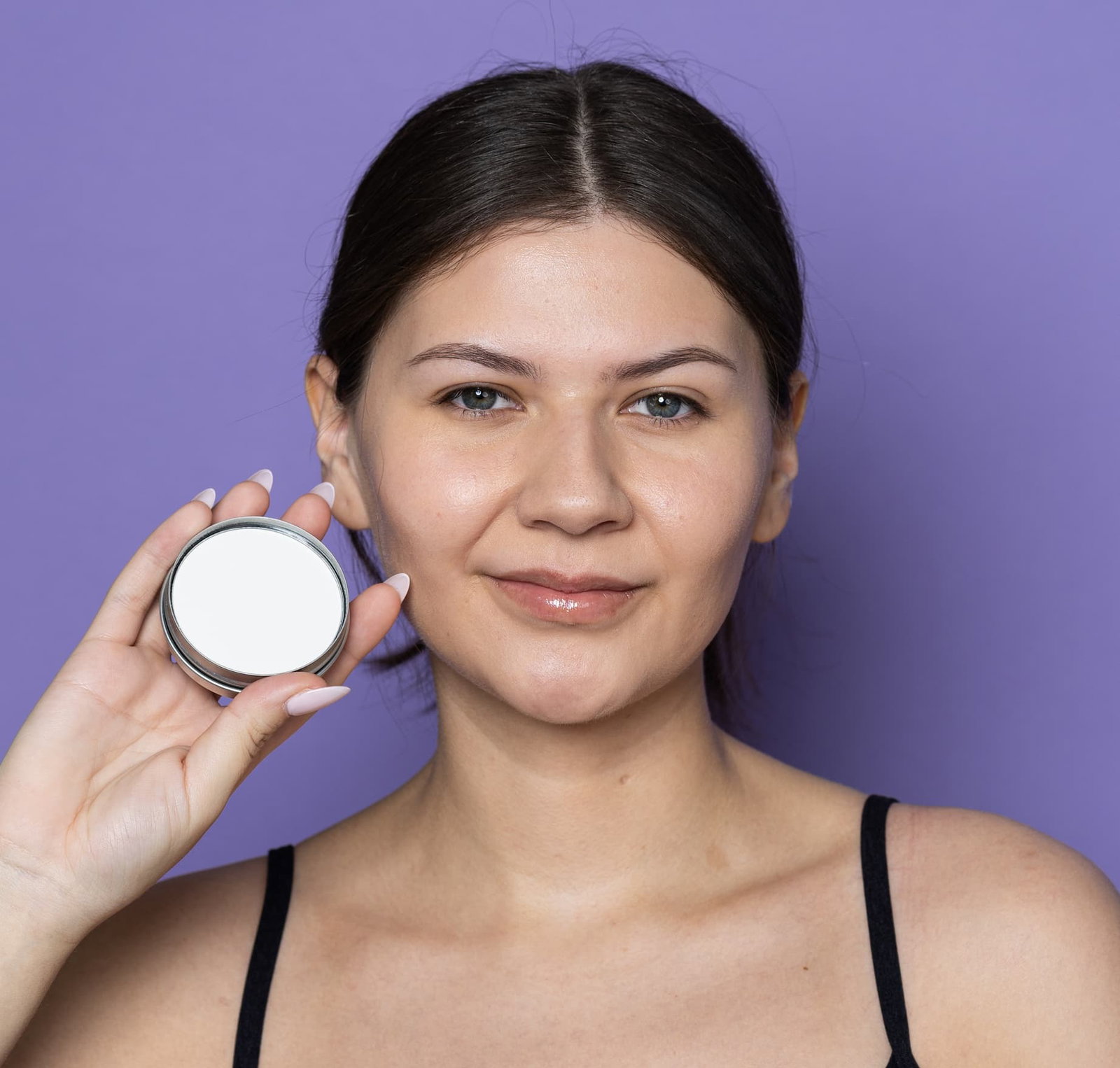 woman holding our mattifying moon dust