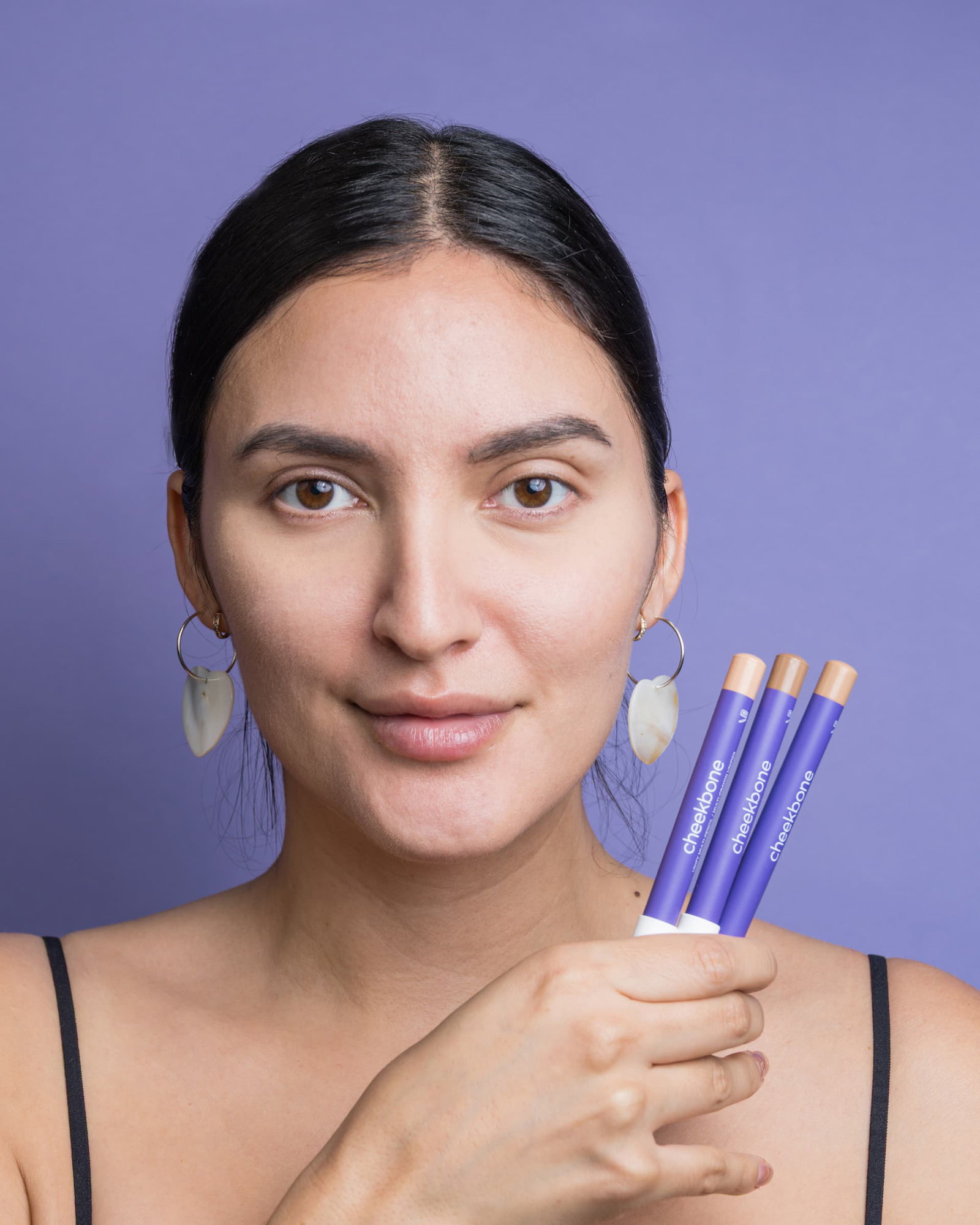 woman holding unify pencils