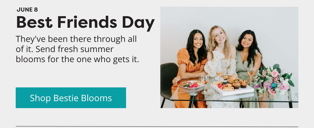 Three friends celebrating with a Callia bouquet and brunch treats