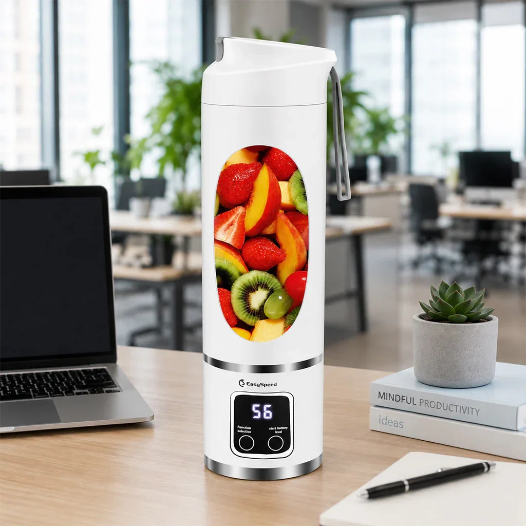 Portable white EasySpeed blender with fruit display on office desk next to laptop and succulent plant