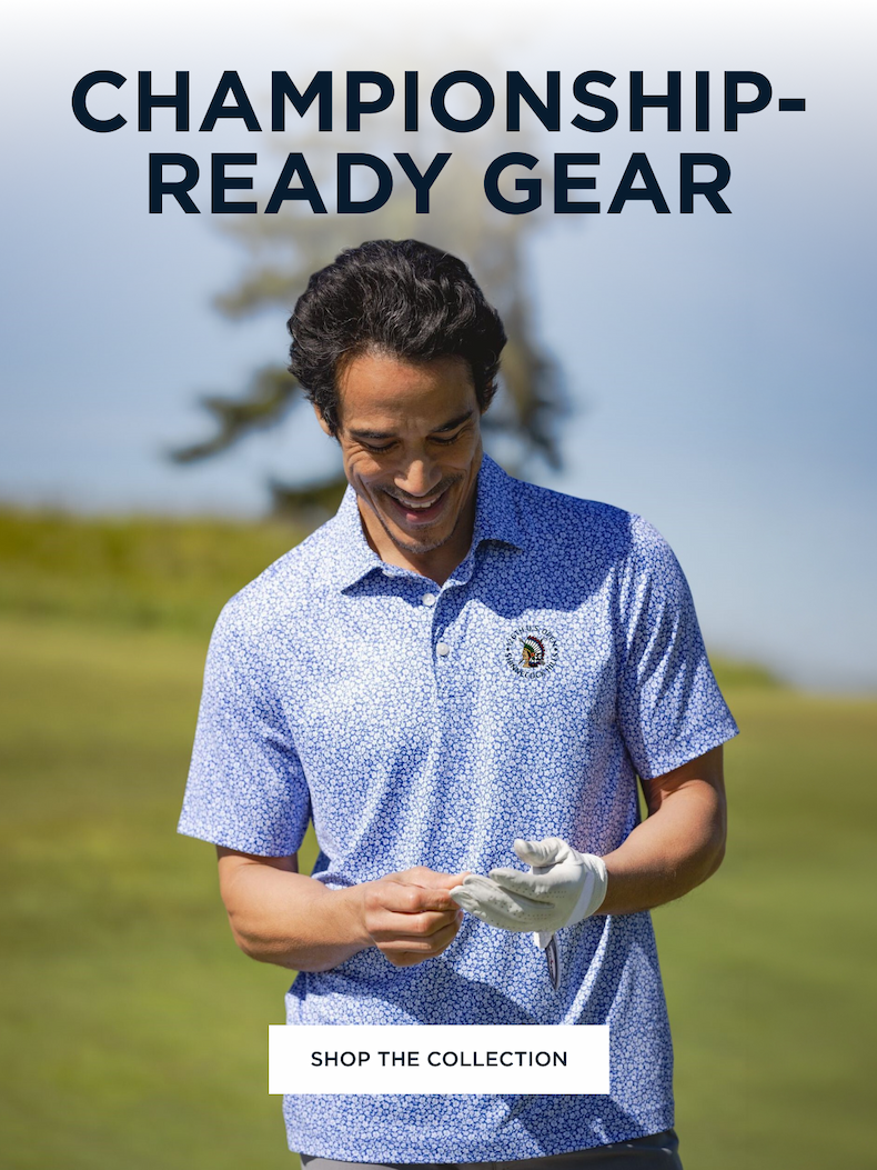 Man golfing and wearing a blue flower print polo with the 2026 U.S. Open logo