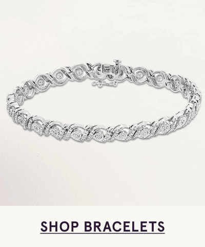 Classic silver tennis bracelet with linked diamond settings. Click here to shop bracelets