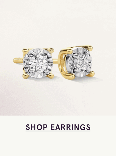 Pair of diamond studs set in gold four-prong baskets. Click here to shop earrings