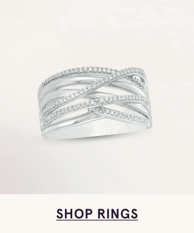 Wide silver band featuring multiple intersecting rows of pavé-set diamonds. Click here to shop rings