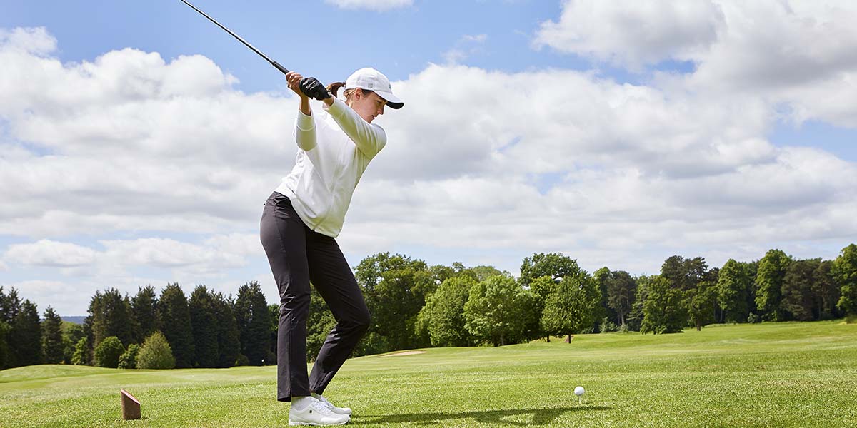 Woman playing golf