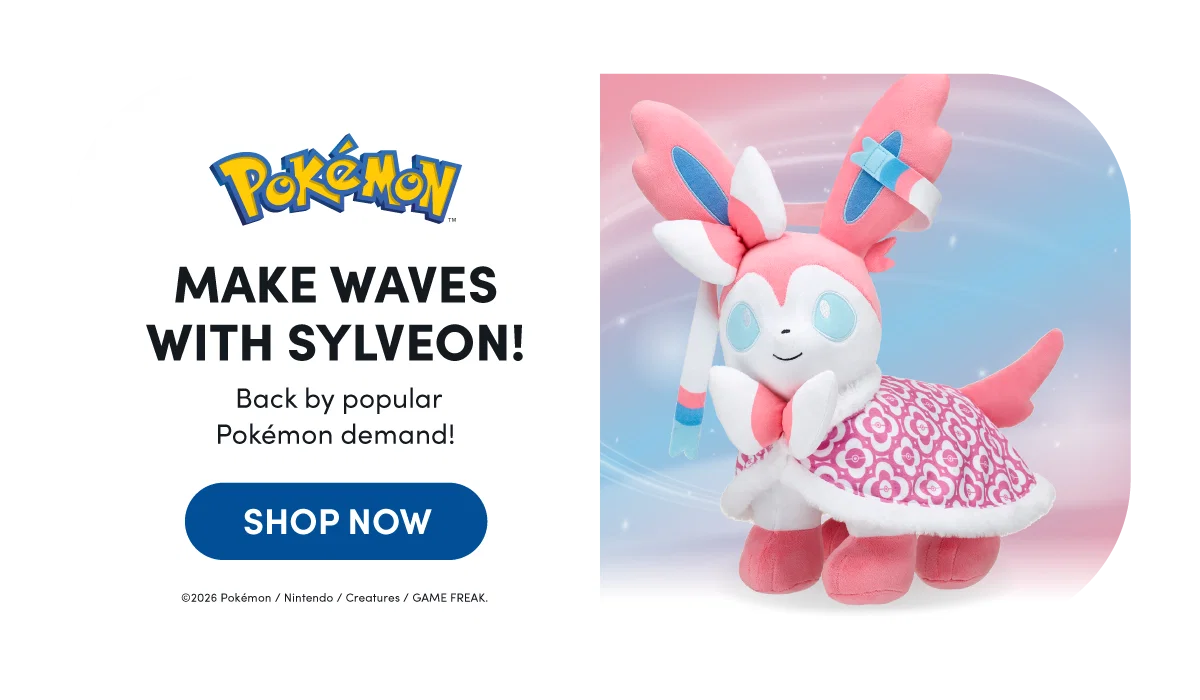 A pink and white Sylveon plush from Pokémon stands on the right against a soft blue and pink gradient background with light sparkles. Sylveon has blue eyes, long ribbon-like feelers with blue accents, and wears a pink patterned skirt with white trim. On the left, the Pokémon logo appears above bold black text reading MAKE WAVES WITH SYLVEON! with smaller text below reading Back by popular Pokémon demand! A blue button reads SHOP NOW