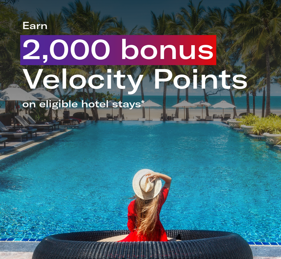 Image of a woman by a pool with text: Earn 2,000 bonus Velocity Points on eligible hotel stays*