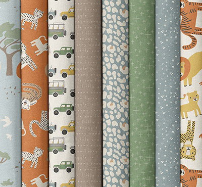 Quilting fabrics in blues, greens, and burnt oranges with safari prints. >>