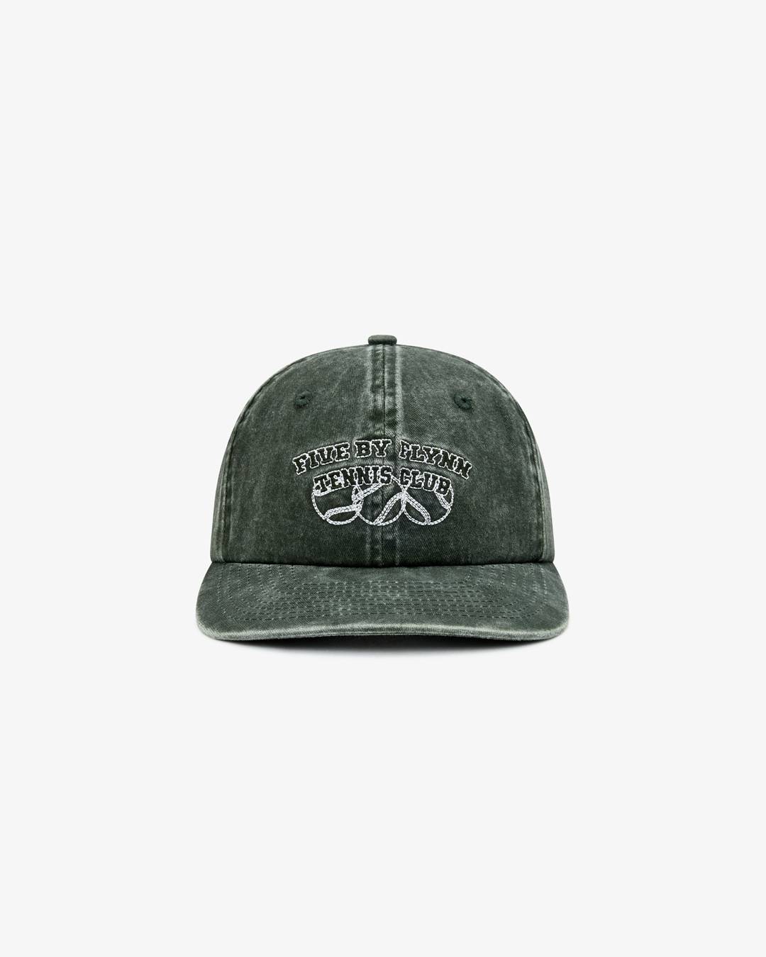A medium shot shows a dark green, washed-out baseball cap with white embroidered text that reads 'FIVE BY FLYNN TENNIS CLUB' above a graphic of three ...