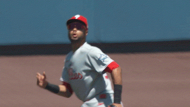 An animated gif of Justin Crawford making a leaping catch against the wall
