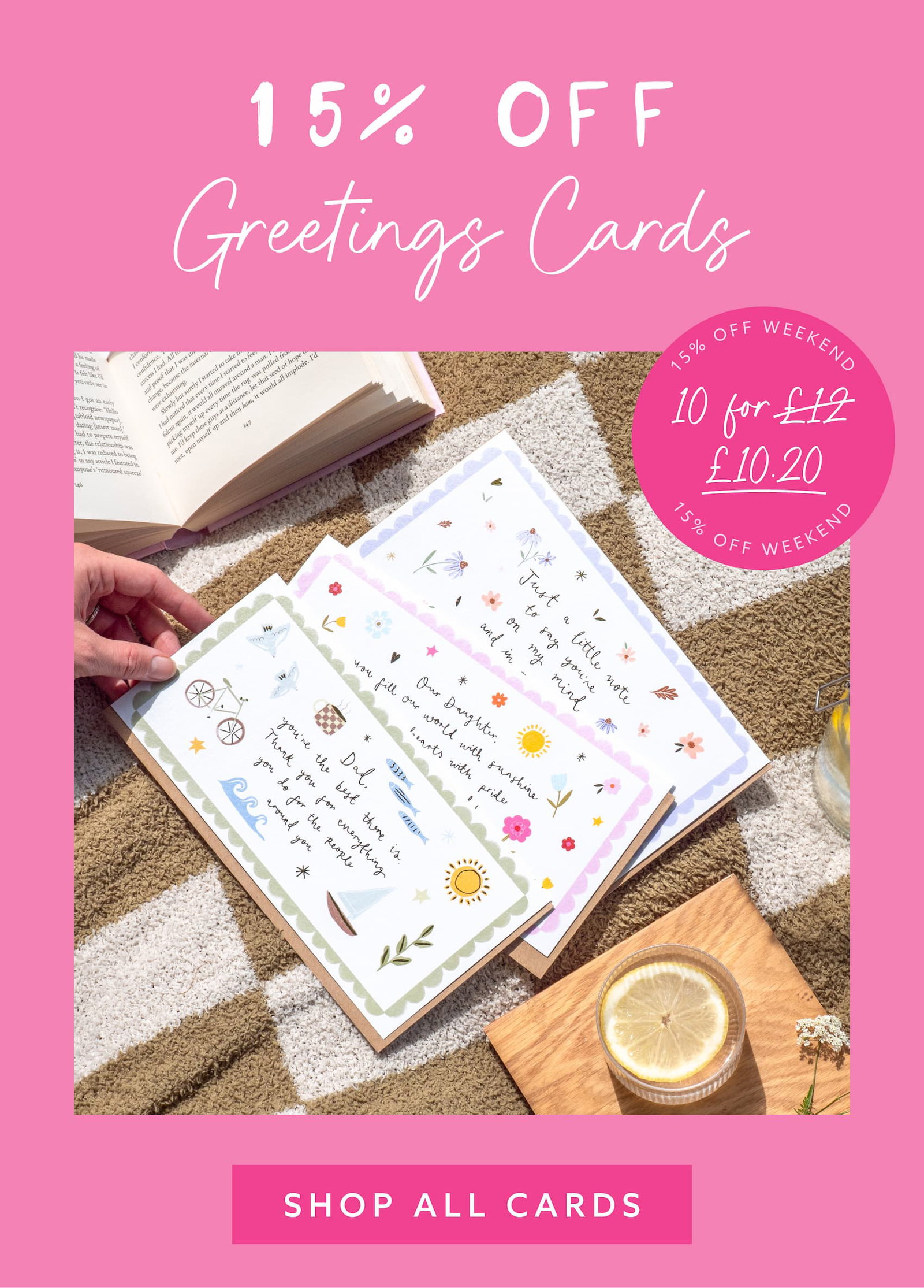 Pink promotional banner featuring floral wrapping paper, lilac ribbon and gift accessories with “15% OFF Wrapping Paper” messaging and multibuy pricing details.