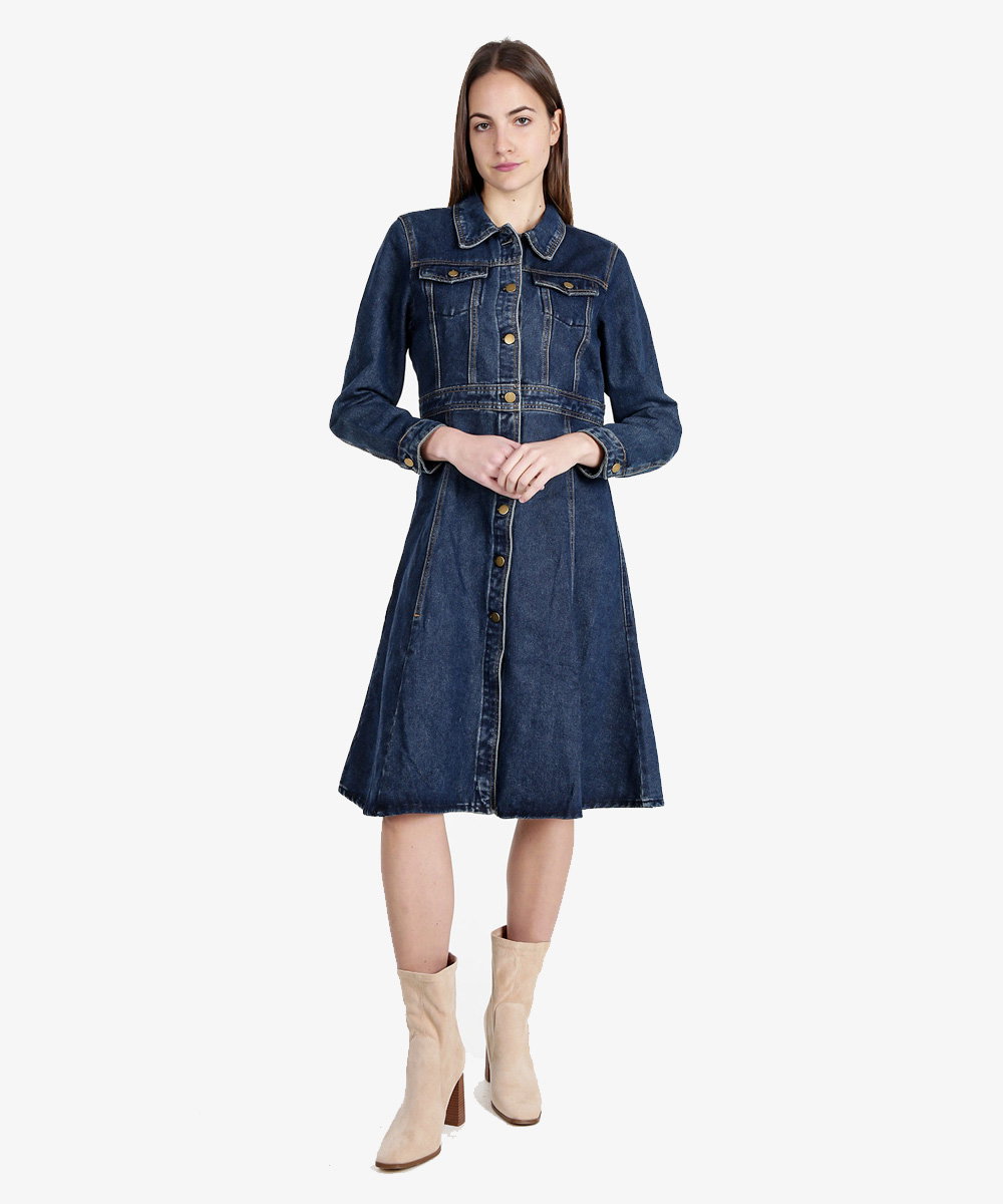 Woman wearing dark blue denim button-front midi dress with long sleeves and cream ankle boots on white background