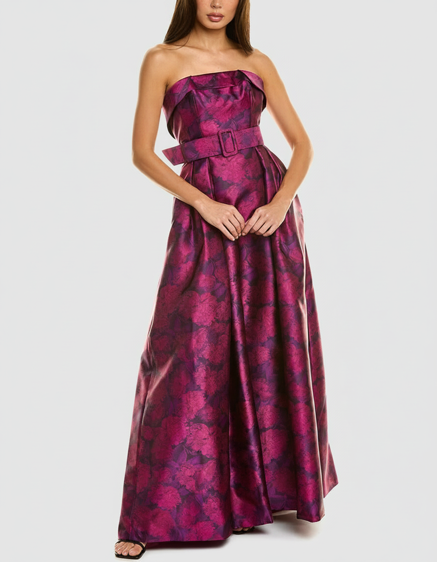 Woman in a strapless, floor-length floral dress with a matching belt.