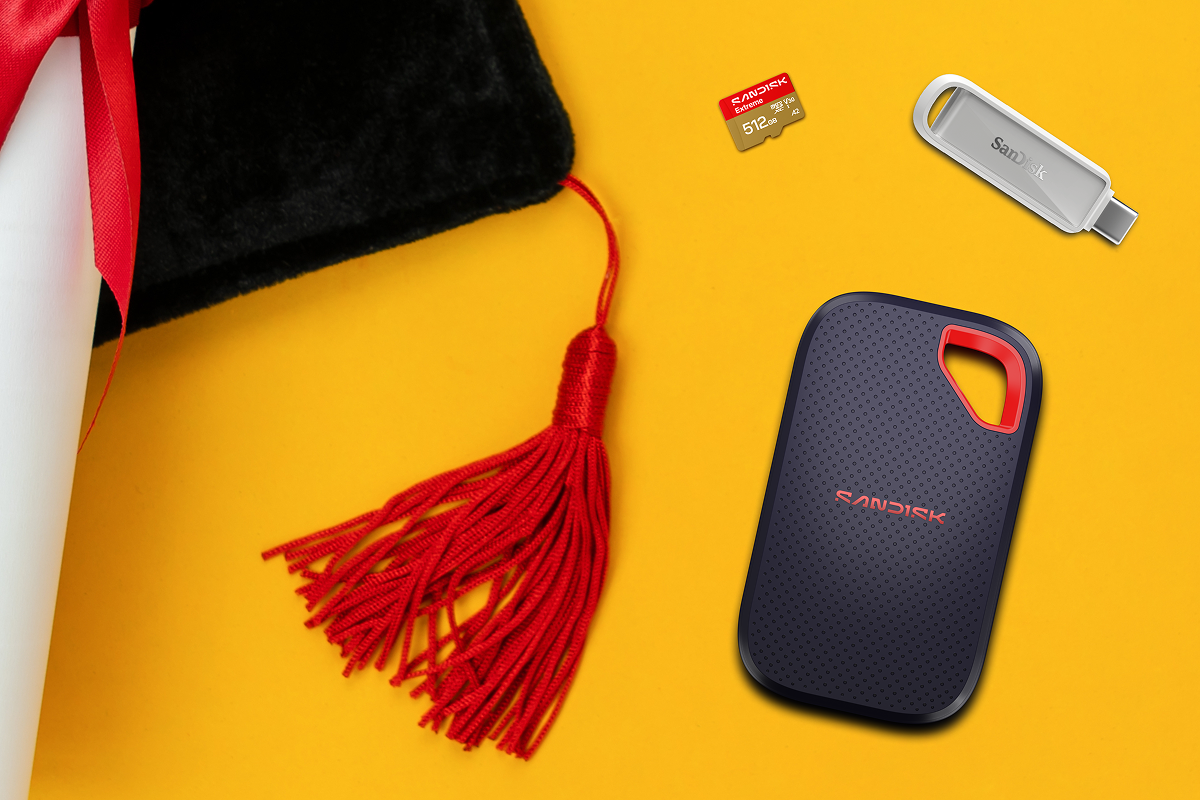 Graduation essentials paired with digital storage: a mortarboard, diploma, and various SanDisk memory devices including a micro SD card, USB, and external SSD.