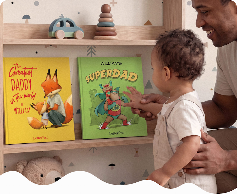 A father and young child looking at two personalised books on a nursery shelf, titled "The Greatest Daddy in the World" and "William's Superdad"
