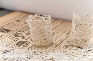 Cut pieces of lace ribbon for this cheap, easy and elegant way to elevate your tablescape
