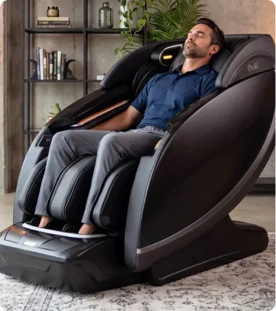 Man relaxing in Osaki Platinum Sapphire in industrial home
