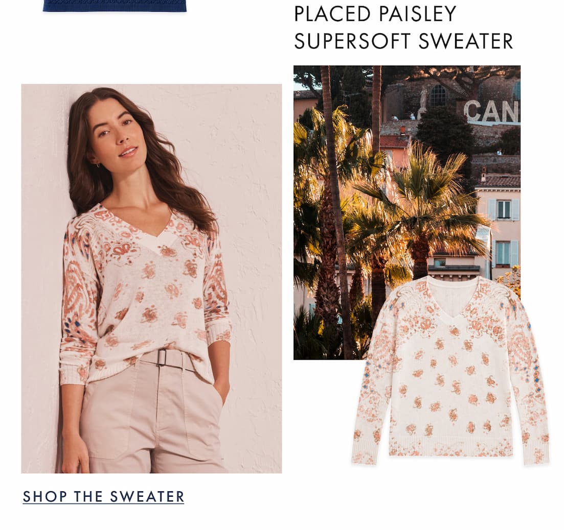 The lady wearing the Placed Paisley Supersoft Sweater. The image showcases a coconut palm trees under the bright sun, capturing a warm summer vibe.