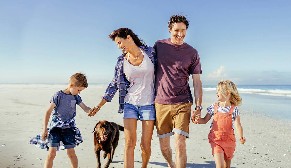 Family walking on the beach