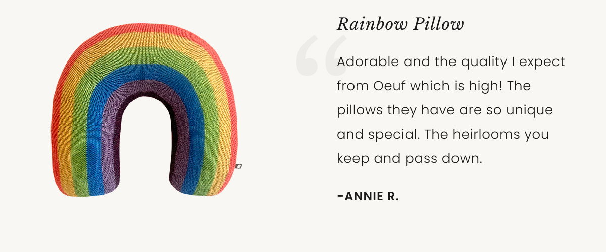 an image of a child's room with a crib and a rainbow