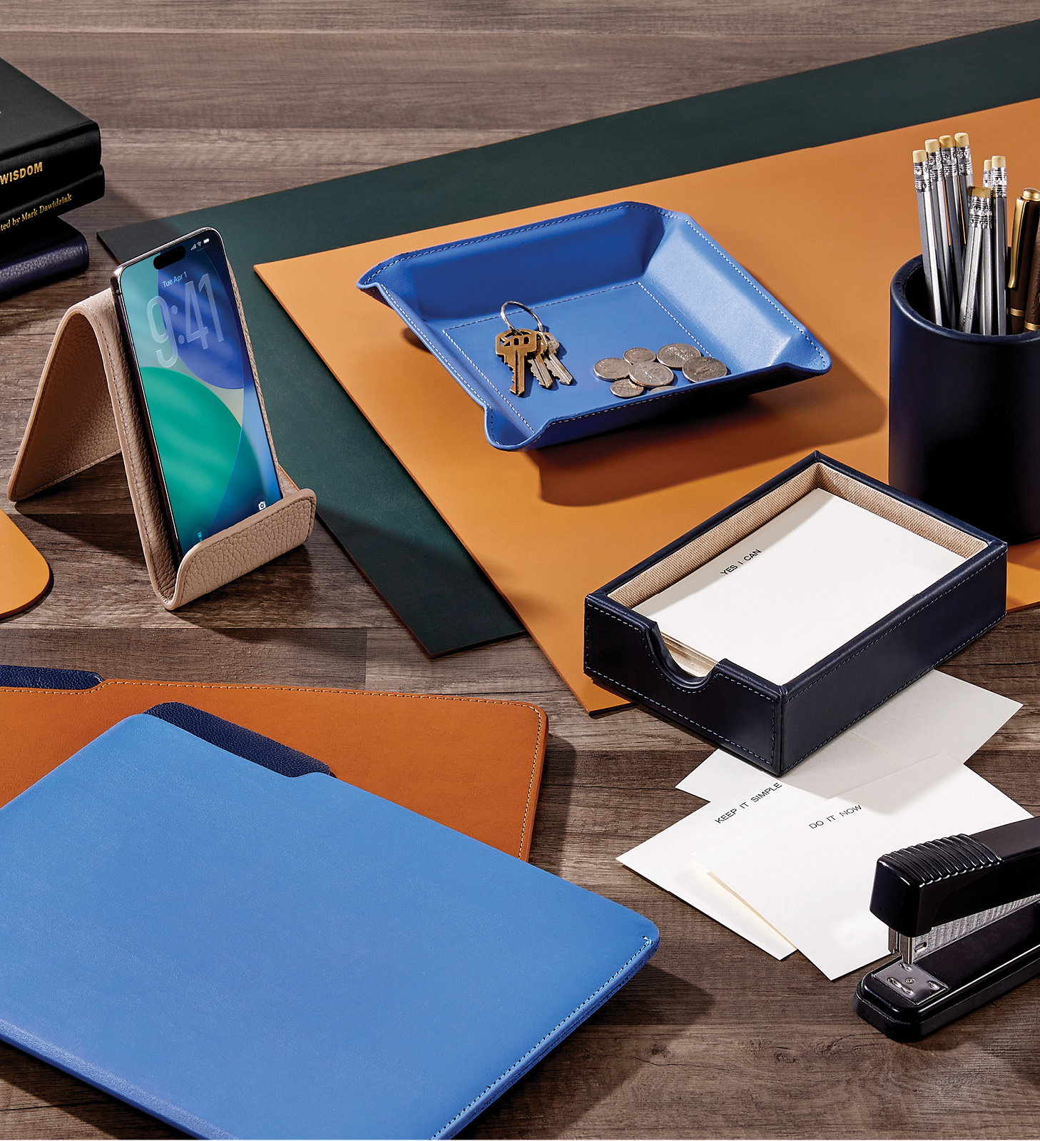Leather desk accessories, including desk blotters and file folders.