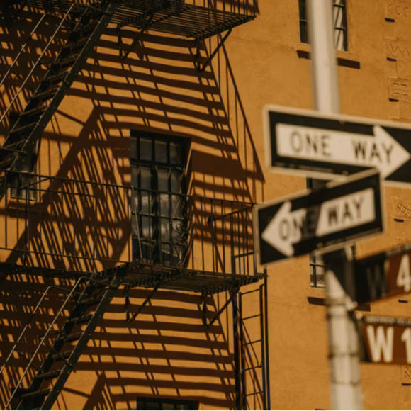 Stairs running up the side of a building and street signs in New York, linking to BA High Life site.