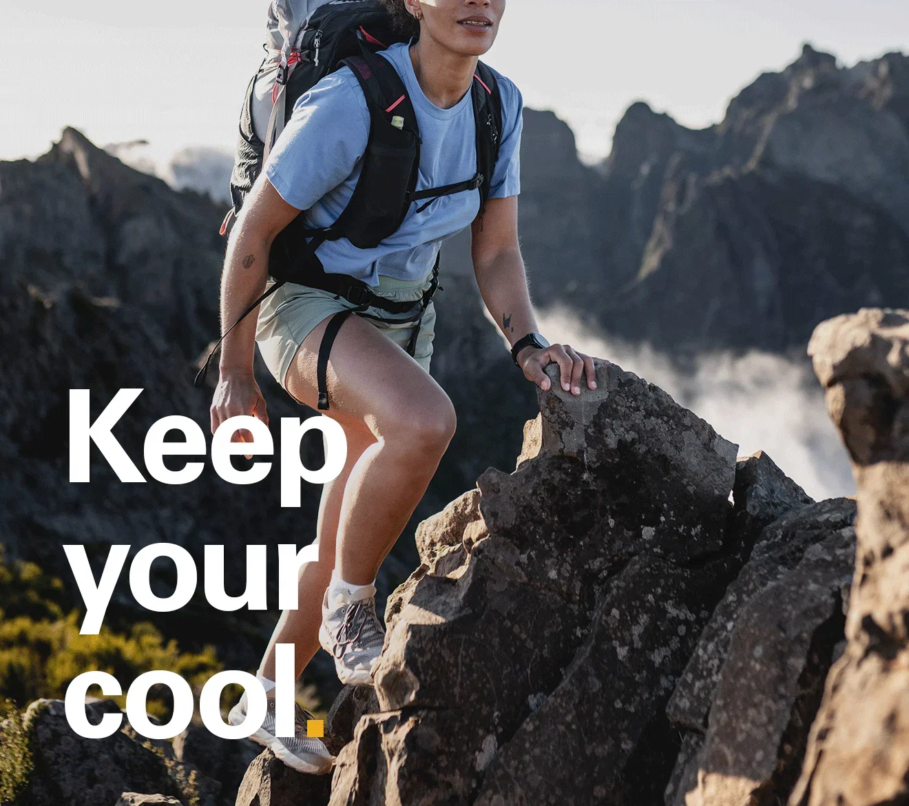 'Keep your cool.' Text on the image of a women hiking on a sunny day up towards the summit.