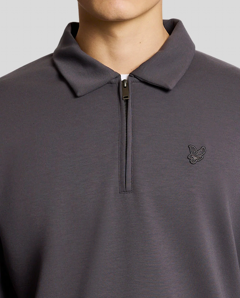 Man wears 1/4 Zip Collar Sweatshirt in Iron