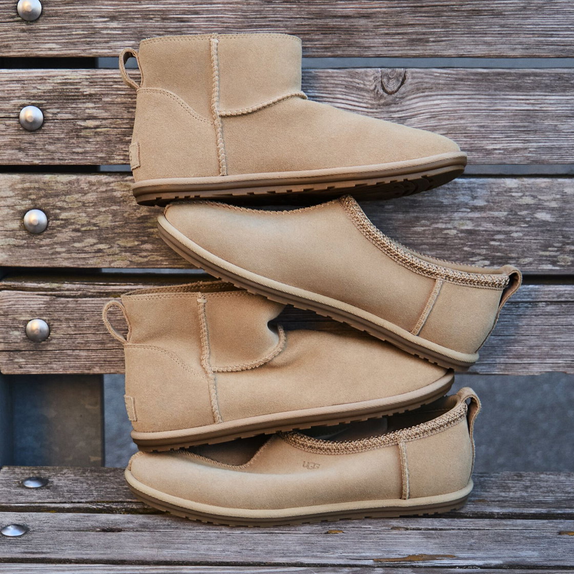 A pair of the Classic Mini and a Pair of Tasman Slippers sitting on top of each other on a wooden bench.