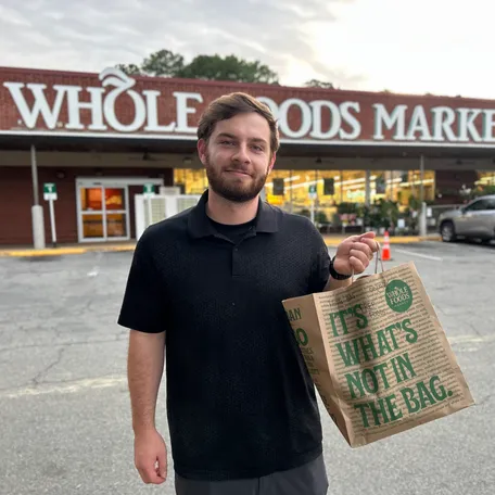 Matthew Hall, 25, of Durham, North Carolina, will often buy a "surprise bag" from Whole Foods through Too Good to Go to stretch his grocery budget. He pays a third of the retail cost.