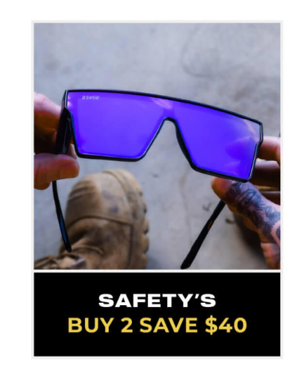 Modern sunglasses with blue-purple tinted lenses held up against sky, labeled safety eyewear