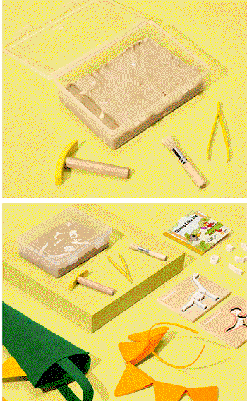 Dinosaur Dig from Koala Crate. Dig bones out of a bin of sensory sand, then put them together to make two dino skeletons.