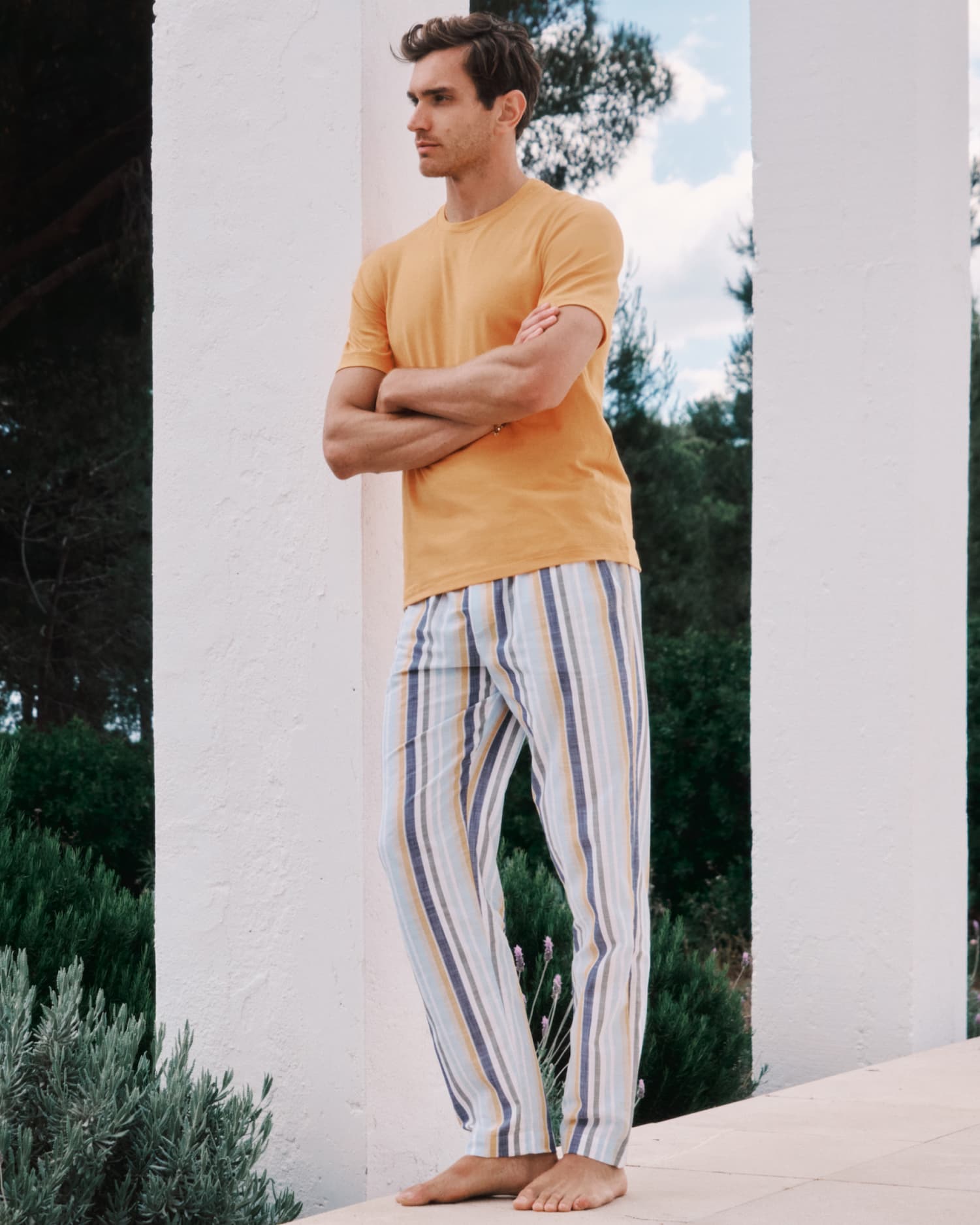 male model wearing Living t-shirt and Night and Day pajama pants